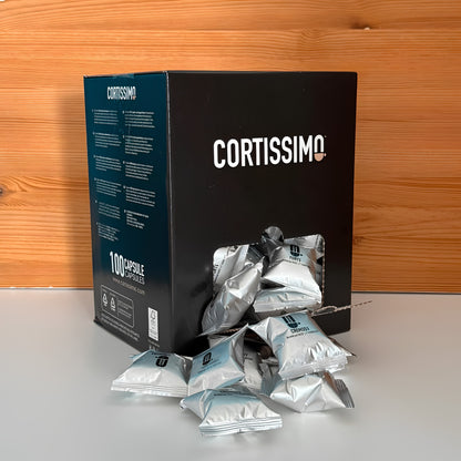 Scatola_100_capsule_aperta_con_capsule